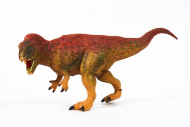 Dinozor lastik oyuncağı beyaza izole edilmiş.