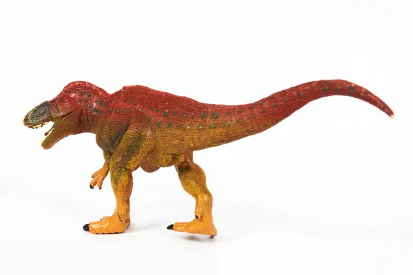 Dinozor lastik oyuncağı beyaza izole edilmiş.