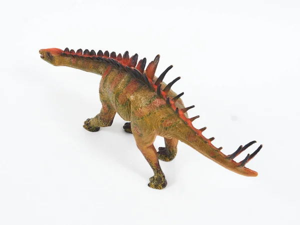Dinozor lastik oyuncağı beyaza izole edilmiş.