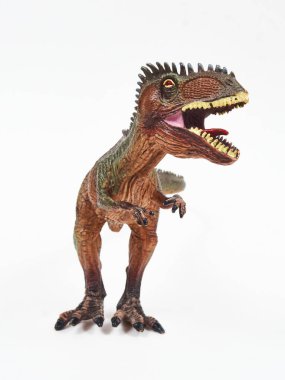 Tyrannosaur plastik oyuncağı beyaza izole edilmiş.