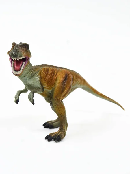 Tyrannosaur rubber toy isolated on white — Stock Photo, Image