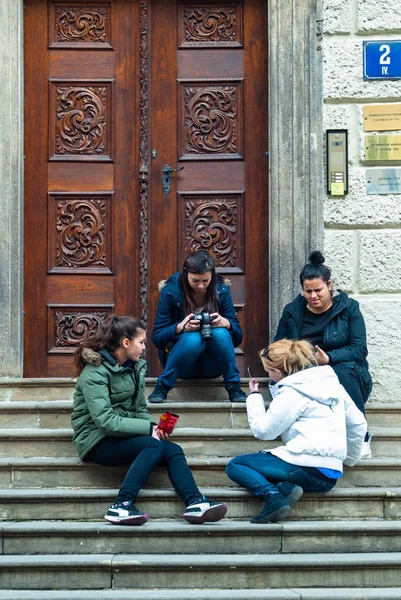 Tourists on the stairs of Saint Vitus Cathedral, Prague