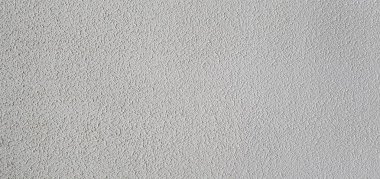 Beton bir duvarın dokusu, dengesizce sıvanmış, rutubet, pürüzler ve düzensizlikler yüzünden lekeler..