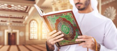 Arabian muslim man reading Quran inside Mosque. clipart