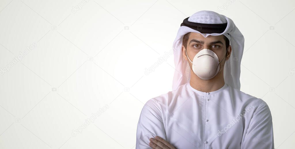 Arab man wearing medical face mask protecting himself from coronavirus