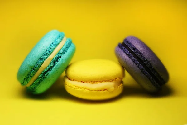 Bright food photography of macroons on yellow background