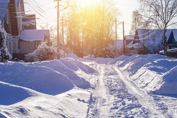 Russian winter village, snow, sun, the central part of Russia.