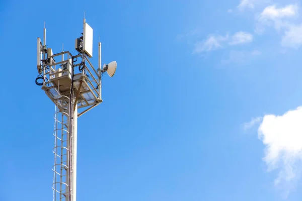 Telecommunications equipment, cell tower, directional mobile phone antenna dishes. Wireless communication