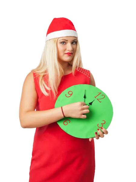 Lachende vrouw in helper kerstmuts met een klok weergegeven: 12 — Stockfoto
