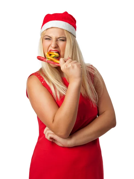 Fille dans un chapeau Santa helper manger des bonbons canne — Photo