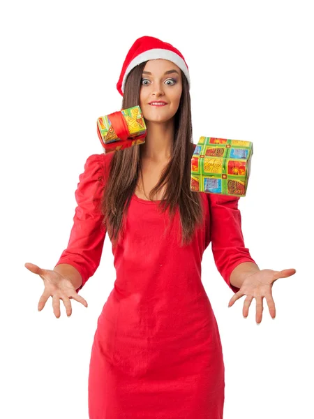 Vrolijk meisje in de rode jurk vangsten uw Kerstcadeaus — Stockfoto
