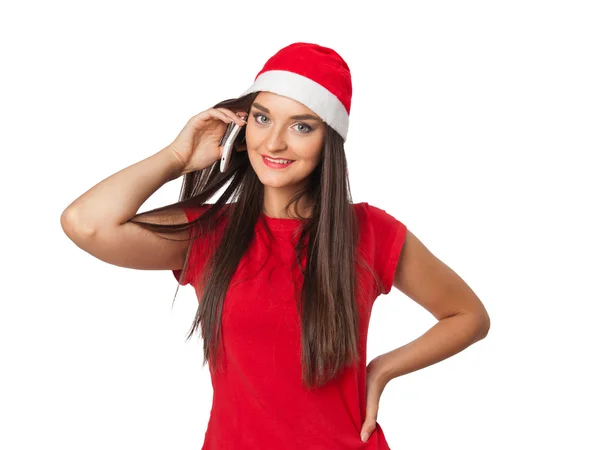 Menina em um Papai Noel 's helper chapéu falando telefone Imagens Royalty-Free