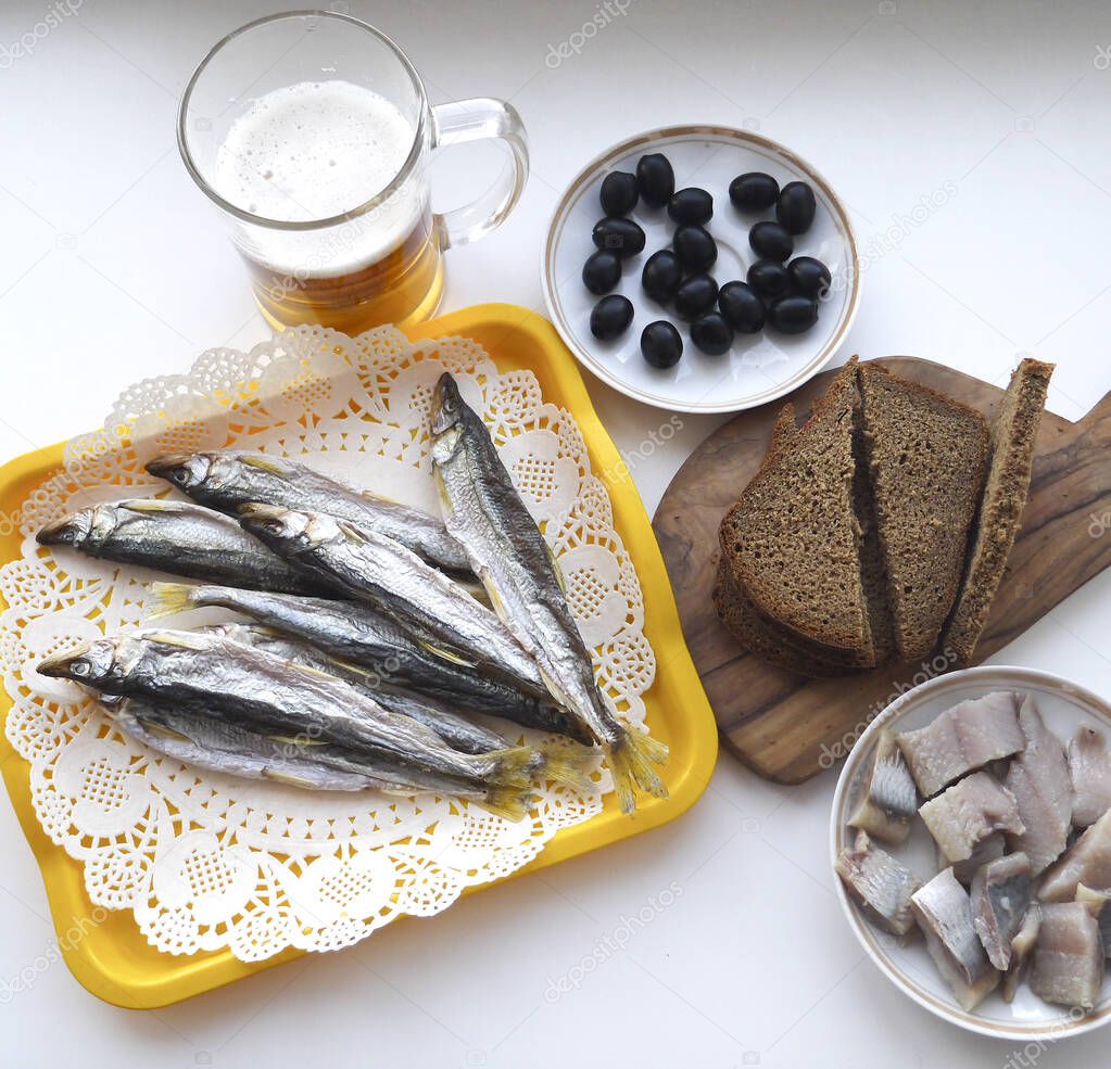 Dried fish, herring, olives and black bread - a great snack for beer