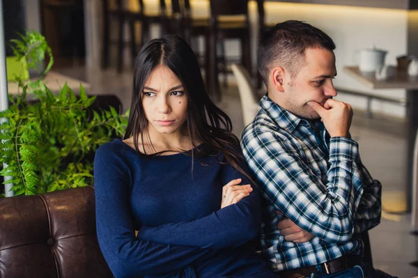 Couple at cafe during lunch. They are taking offense and sitting back — Stock Photo, Image