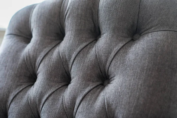 Seamless background texture close up of a grey sofa back with button detail on a thick cloth. — Stock Photo, Image