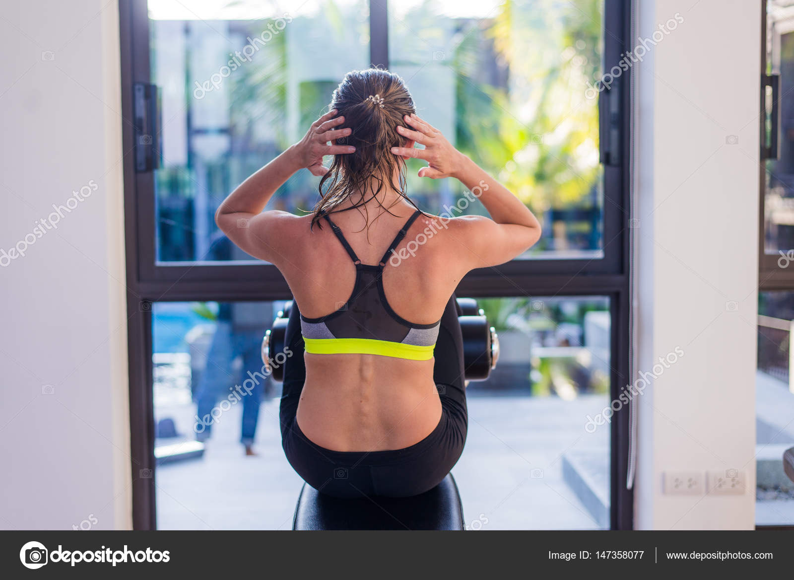 Attractive Fit Woman Working Out Abs In Fitness Gym At Luxury Resort Hotel With A Great View During Summer Vacation Stock Photo C Romankosolapov