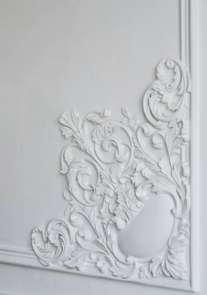 White wall molding with geometric shape and vanishing point. Luxury white wall design bas-relief with stucco mouldings roccoco element