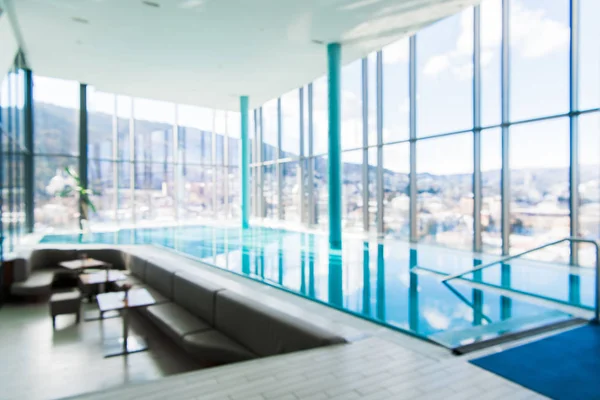 Abstract luxe binnenzwembad achtergrond wazig — Stockfoto