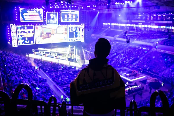 MOSCOW, RUSSIA - 14th SEPTEMBER 2019: esports Counter-Strike: Global Offensive event. Happy dedicated games fan cheering for his favorite team on a tribunes in front of a big screen. — ストック写真