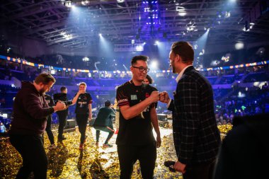 MOSCOW, RUSSIA - 14th SEPTEMBER 2019: esports gaming event. Journalist interviews a gamer, winner of a match on a stage.