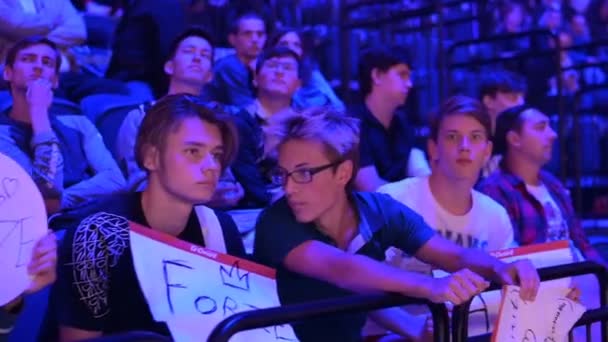 MOSCOW - SEPTEMBER 14 2019: esports Counter-Strike: Global Offensive event. Fans on a tribunes with posters supporting their favorite team. — Stock Video