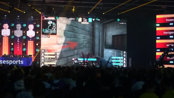 MOSCOW - DECEMBER 23 2019: esports gaming event. Main venue, lots fans with posters watching the game and supporting favorite teams. Big crowd at arena. — Stock Video