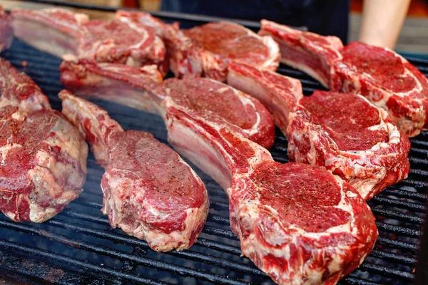 Raw fresh meat rib eye steak on grill