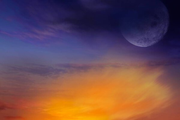 Glowing sunset and full moon . Beautiful cloudy sky. Cloudy abstract background. Sunset colors. Red sunset and moon . Light in dark sky
