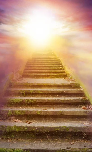 Light in dark sky . Stairs in sky .  Religion for the person . Way to heaven . Way to God . bright light from heaven . Religious background . steps leading up to the sun