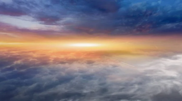 Light from the sun shining through the clouds in the sky . Dramatic nature background .  Sunset or sunrise with clouds, light rays and other atmospheric effect . Light from sky . Religion background .