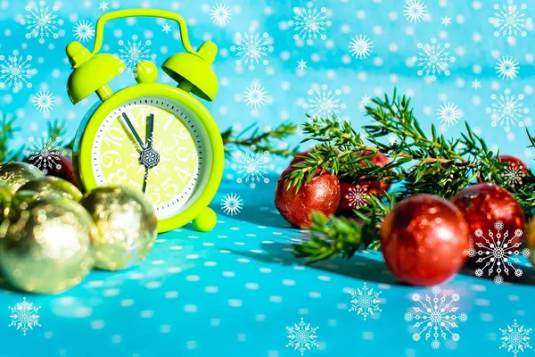 Art Christmas or New years eve; holiday background . Christmas Eve and New Years at midnight . Alarm clock. Clock arrows at midnight