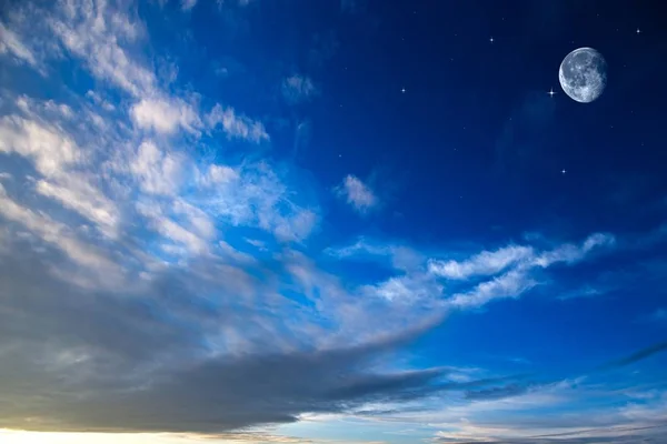 Moon Clouds Skies . White moon over stormy clouds . Dramatic nature background . Full moon background . landscape  . Young month in night sky