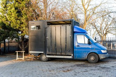 horse vehicle .  Carriage for horses . Auto trailer for transportation of horses . transportation livestock . Horse transportation van , equestrian spot
