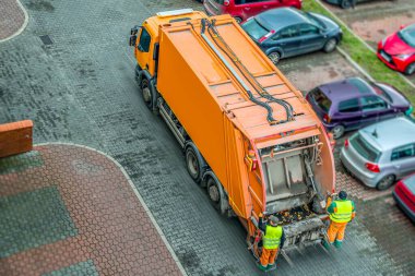 Urban recycling waste and garbage services . Orange truck, garbage removal .  clipart