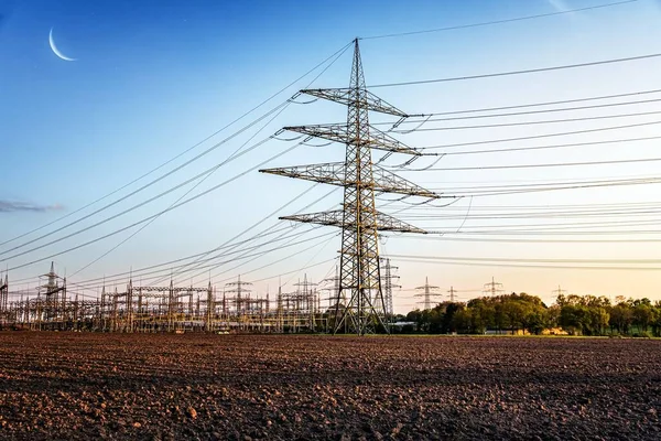 The power transmission towers of sunset sky background . Electric Tower