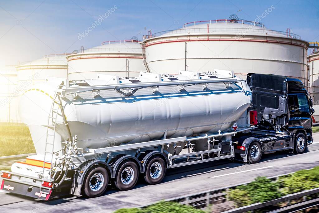 Truck moves on the road at speed, delivery of goods.  Fuel tankers . Tank for the carriage of liquid and dangerous goods