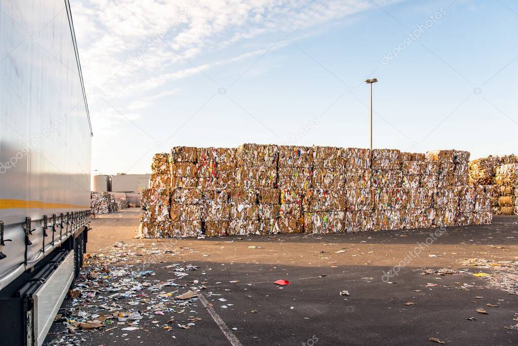Recycle industry . Paper and cardboard for recycling . Truck Loading Dock 