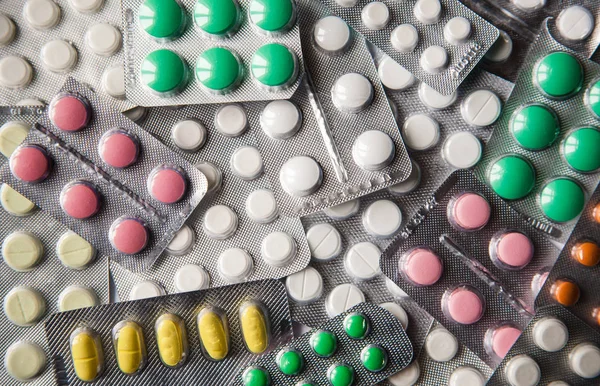arka plan olarak çeşitli hapların yüzeyi, ilaç eczanesi 