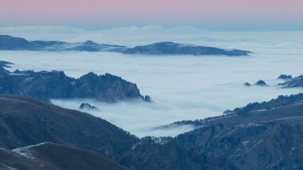 The formation and movements of clouds up to the steep slopes of the  mountains of Central Caucasus peaks. — Stock Video