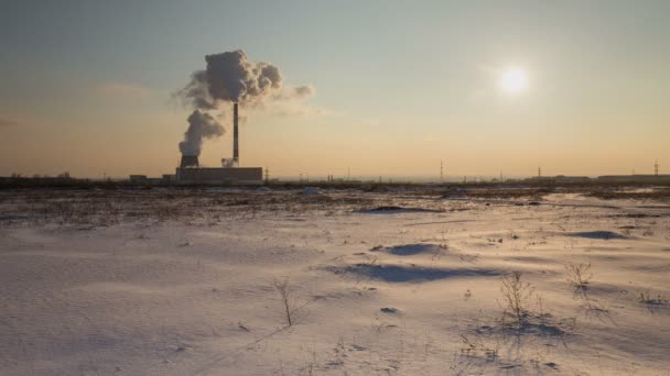 Clouds of steam cogeneration plant over winter evening at sunset. — Stock Video