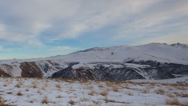 The formation and movement of clouds above the volcano Elbrus in the Caucasus Mountains in winter. — Stock Video