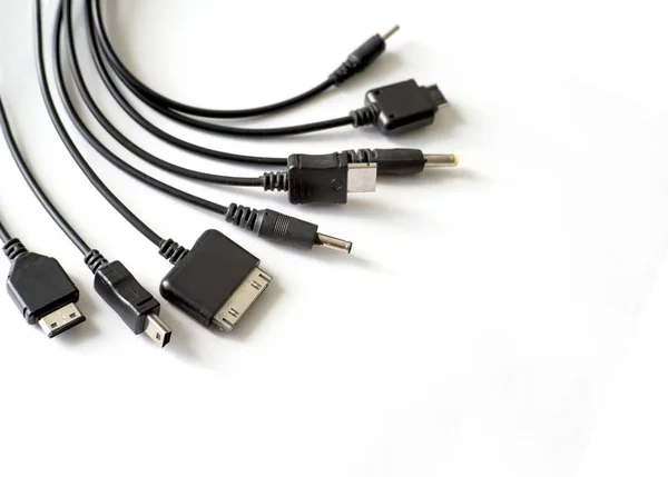 Different types of chargers for phones — Stock Photo, Image