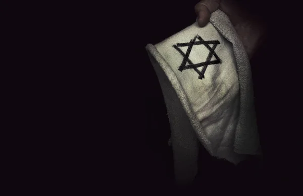 Closeup of a ragged Jewish badge — Stock Photo, Image