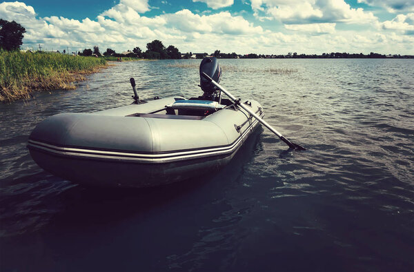 Inflatable boat on the wide river