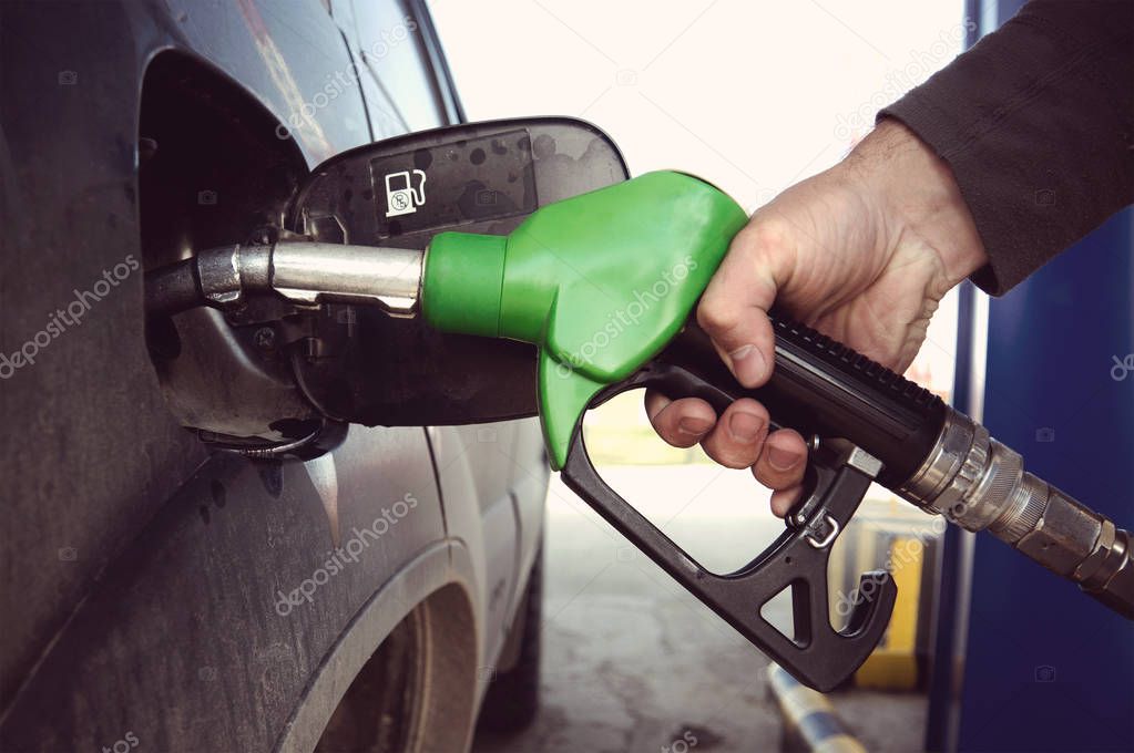 Fill up fuel at petrol station
