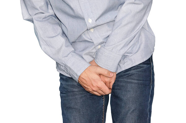 Close up of a man with hands holding his crotch, isolated in white