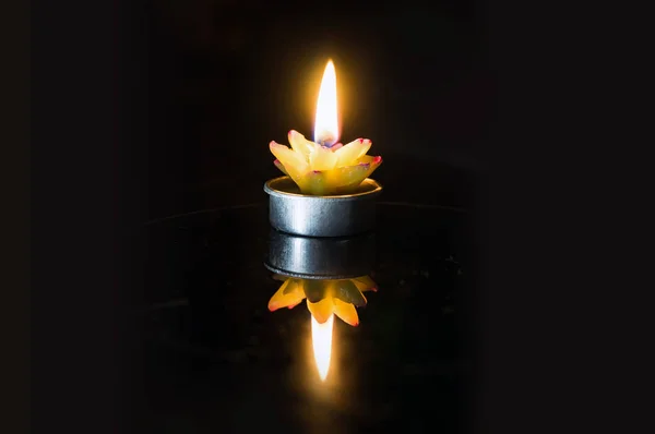 Candle burning bright in the dark — Stock Photo, Image