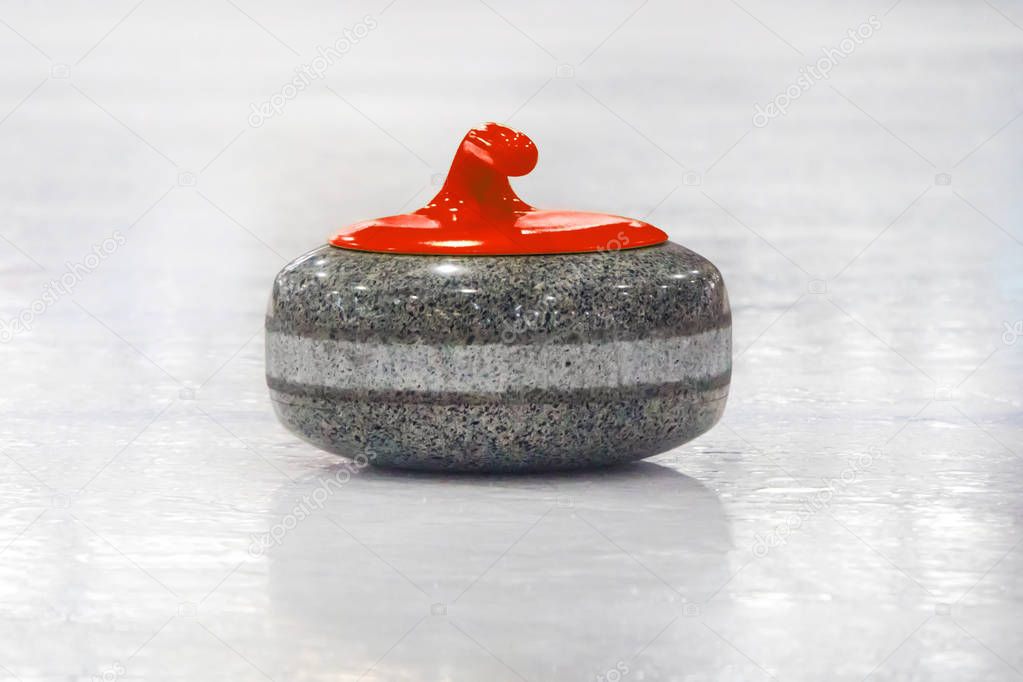 Curling stones lined up on the playing field