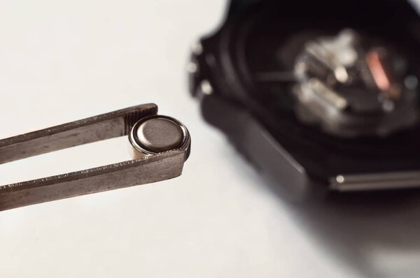 macro of replacing a watch battery