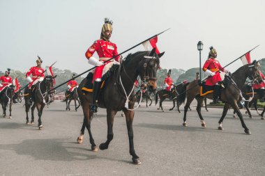 Mounted soldiers parading down the Raj Path, New Delhi in preparation clipart